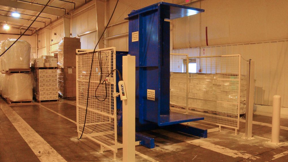 Pallet Inverter with guarding on a receiving dock