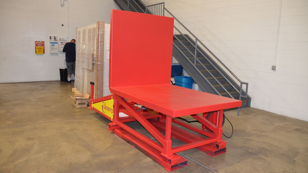 Low duty tipper designed to tip large electrical panel assemblies