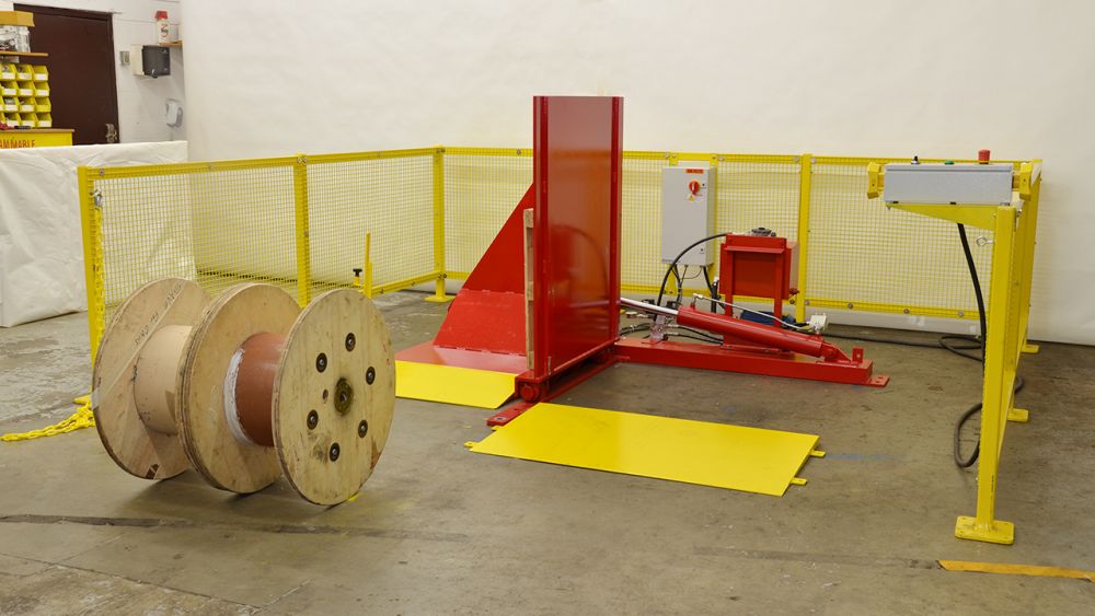 Ramp loaded coil tipper with safety controls