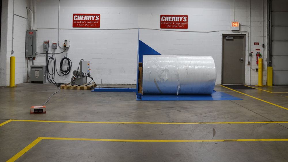 Ground level loaded tipper upending multiple rolls