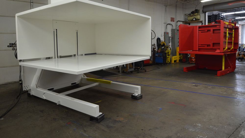 White SC Pallet Inverter next to Custom DC Pallet Inverter