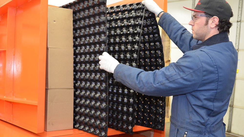 Operator removing plastic freezer spacers