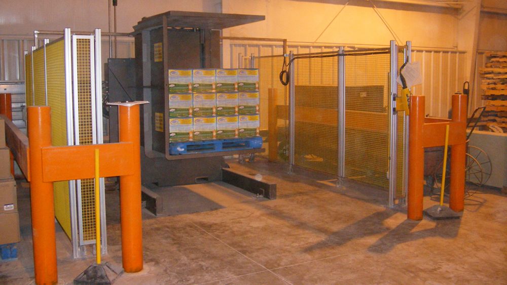 Pallet Inverter turning over boxes of kitty litter to recover damages cases