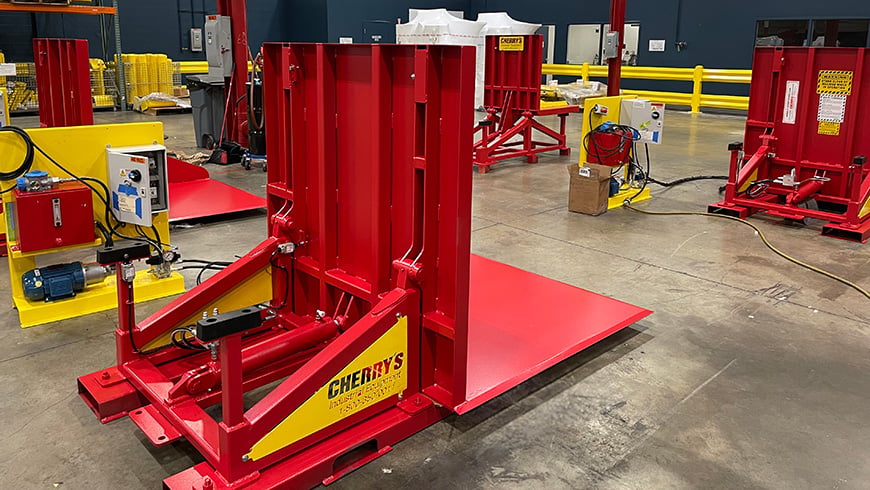 Load at ground level and remove rolls at a raised height (vice versa)